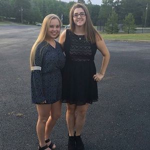 A black party dress with a accent of light pink